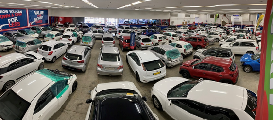 A range of damaged cars for sale at Hallmark Auto