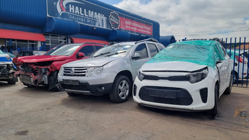 Different codes of damaged vehicles are sold at Hallmark Auto