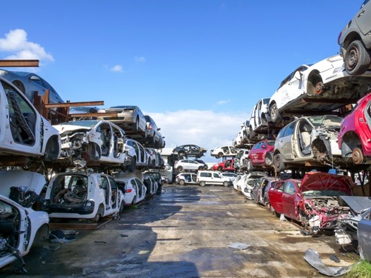Salvage cars are displayed for sale