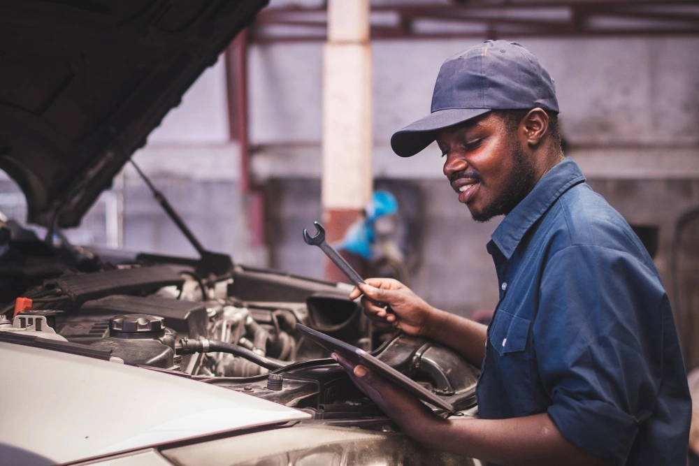 Man fixing salvage car